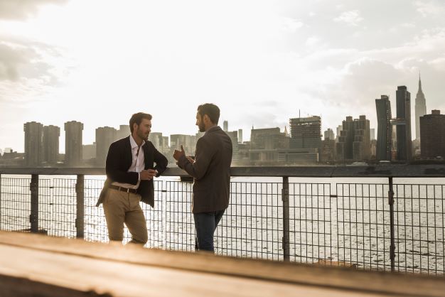 businessmen talking at east new york city