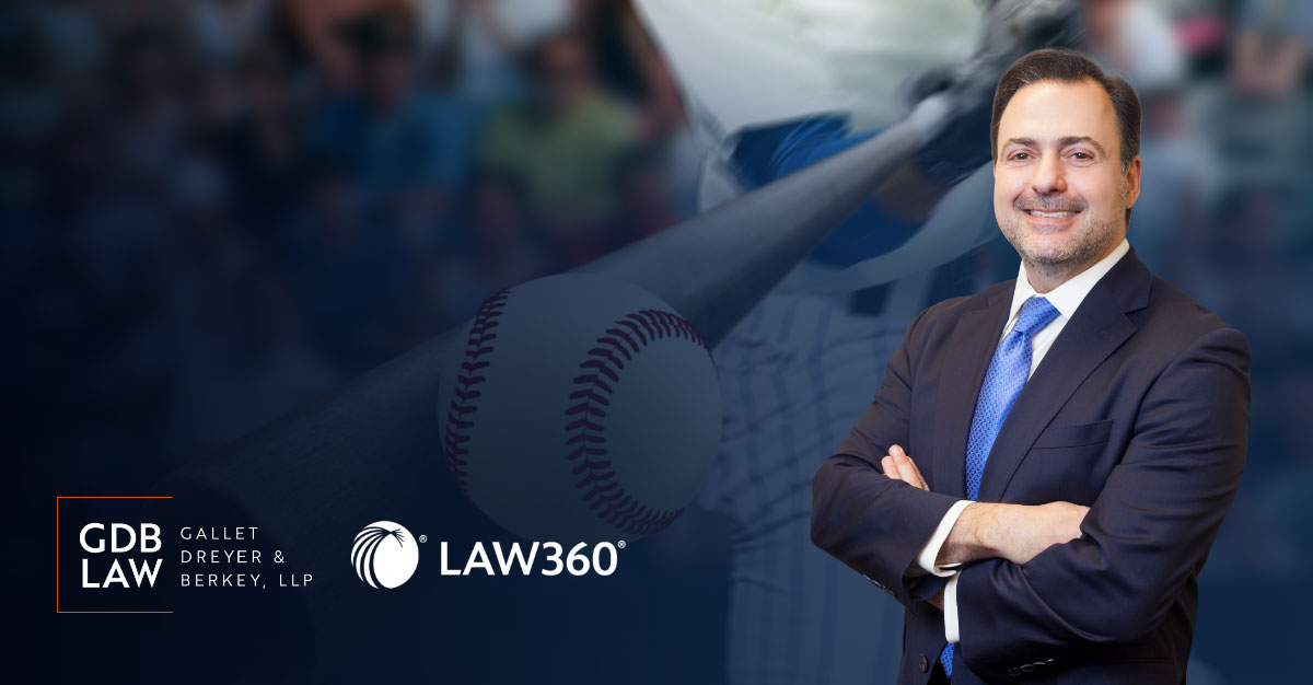 Asher Rubinstein in front of baseball being hit