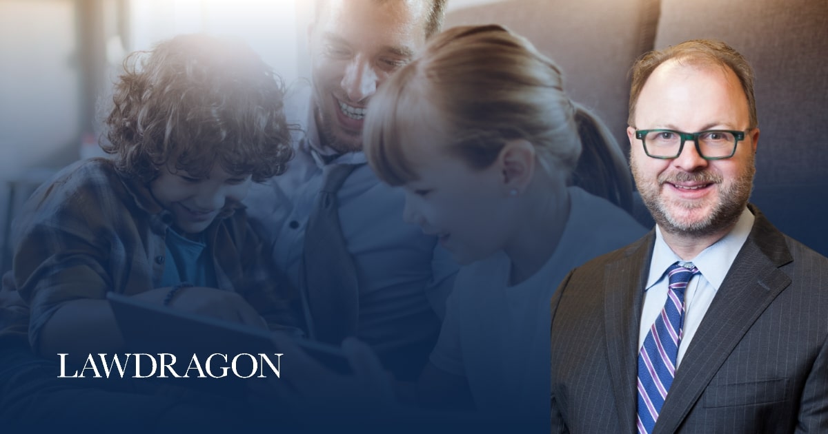 Headshot of Allen A. Drexel in the right foreground of the image. In the background, a father and two children are joyfully looking at a tablet together, softly blurred. The text ‘LAWDRAGON’ appears on the lower left corner.