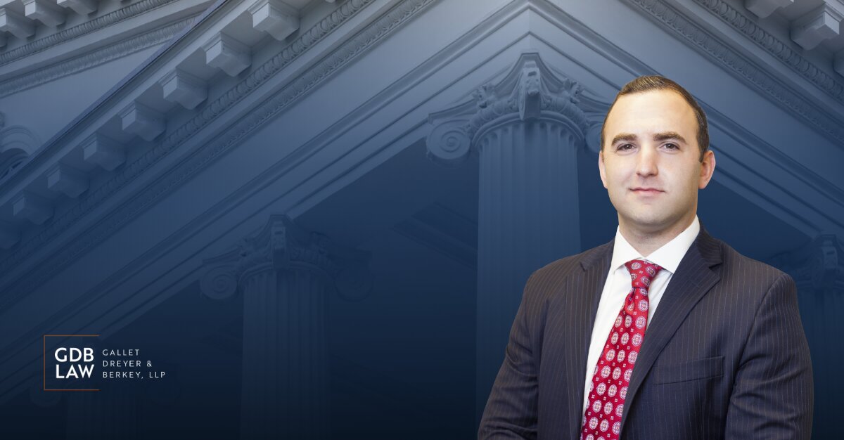 Headshot of Adam J. Berkey in the foreground of a blue-toned background featuring courthouse columns, with the GDB Law (Gallet Dreyer & Berkey, LLP) logo displayed on the left.