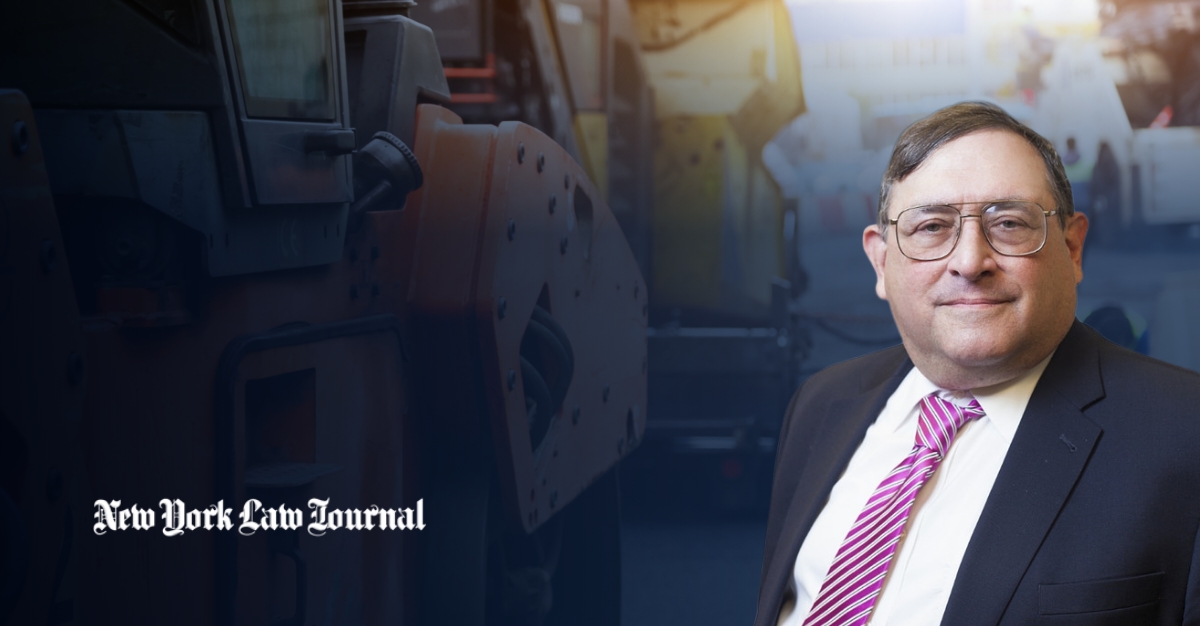 Eugene Goldberg in a suit and striped tie against a background of heavy construction equipment. The New York Law Journal logo appears in the lower left.