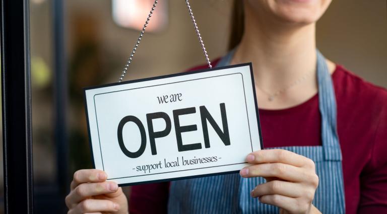 open sign in a small business shop