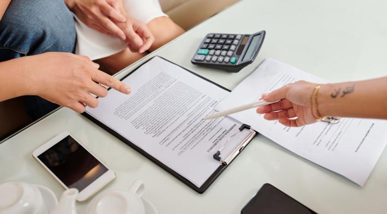 couple signing residential lease agreement