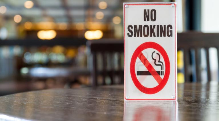 no smoking sign on a table