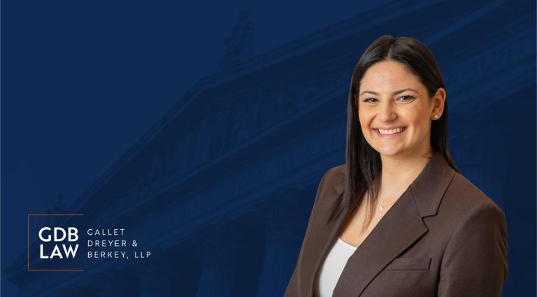 Sydney Goldstein's Headshot on Navy Blue Background