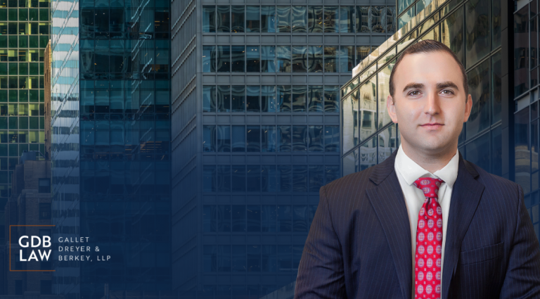 Headshot of Adam J. Berkey standing in front of a cityscape of glass office buildings. On the left side, the GDB Law (Gallet Dreyer & Berkey, LLP) logo appears over a blue gradient background.