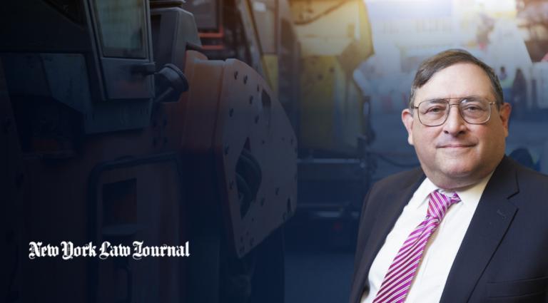 Eugene Goldberg in a suit and striped tie against a background of heavy construction equipment. The New York Law Journal logo appears in the lower left.