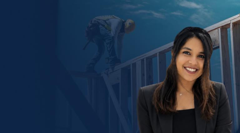 Headshot of Ritika Vig in the right foreground of a blue-toned background featuring a close-up of construction worker building a structure.